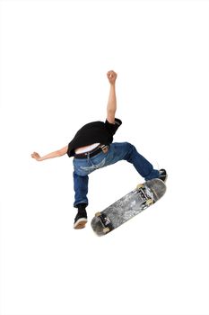 Skateboarder doing a kickflip with his board, Shot in studio and isolated on white with some motion blur