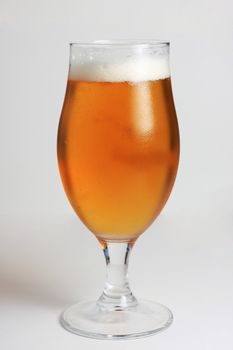 Glass of beer with water condensing on the glass