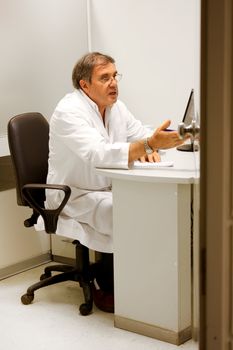 Doctor working in his office