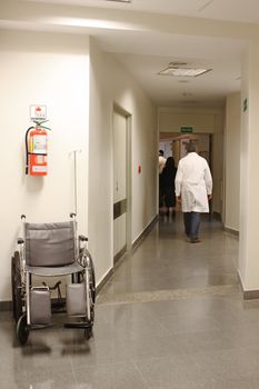 Doctor walking at the hospital corridor