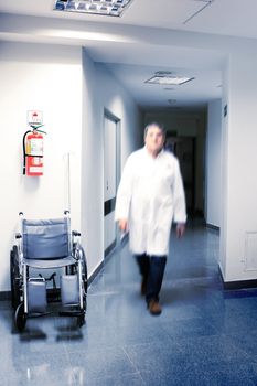 Doctor walking at the hospital corridor