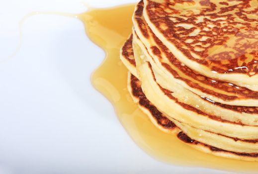 pile of american pancakes with syrup