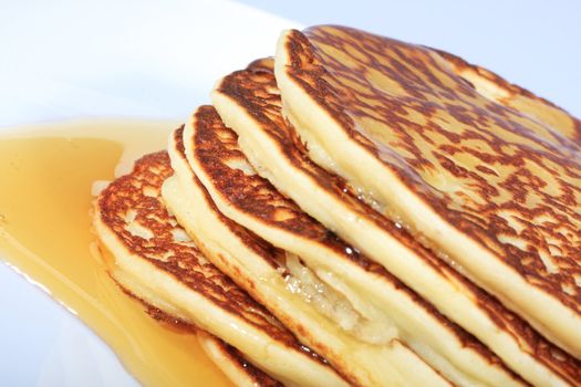 pile of american pancakes with syrup