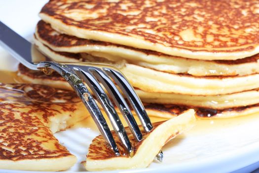 pile of american pancakes with syrup