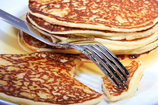 pile of american pancakes with syrup