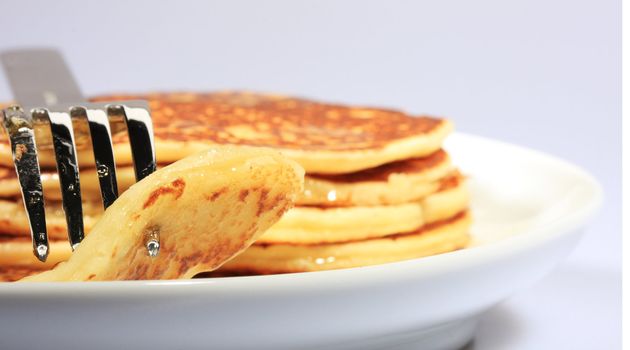 pile of american pancakes with syrup