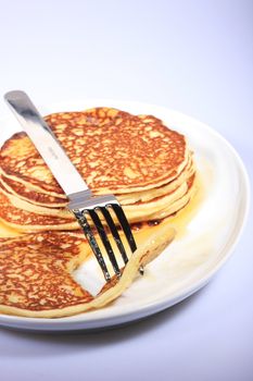 pile of american pancakes with syrup