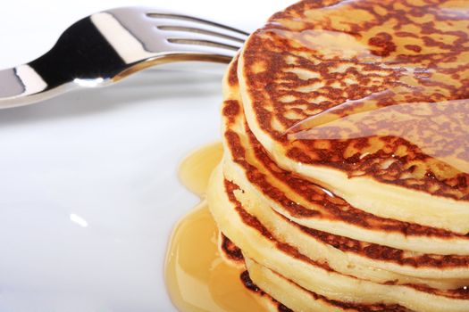 pile of american pancakes with syrup