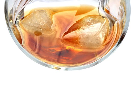 Glass of whiskey with ice cubes isolated on white background with clipping path