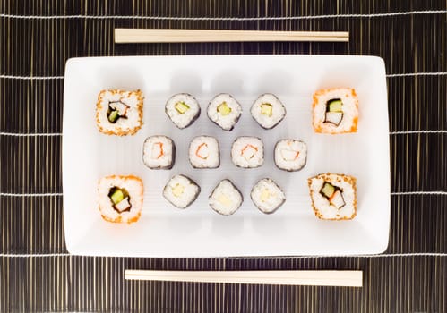 a plate with different kinds of sushi