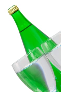 green bottle and glass of water