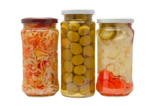 Glass jars with marinated vegetables  isolated on the white background
