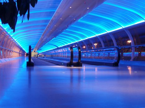 airport walkway tunnel with blue lights, manchester airport