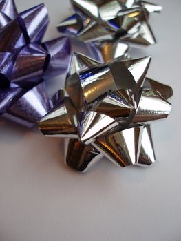 silver and purple present wrapping ribbons   