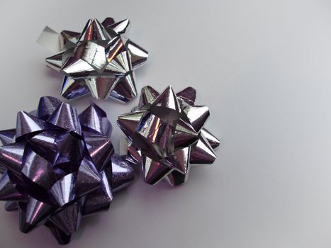 silver and purple present wrapping ribbons   