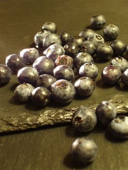 blackcurrants on a slate background