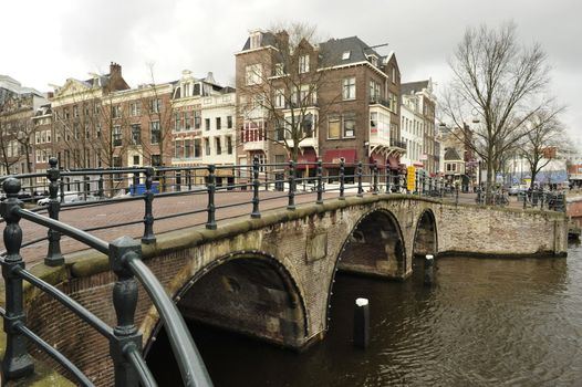 Dutch bridge at Waterlooplein Amsterdam under grey sky