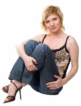 beautiful woman sits on a white background