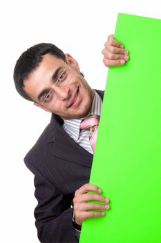 smiling businessman looks out from behind the green sheet