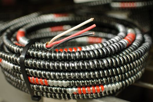 a coil of copper armored cable.