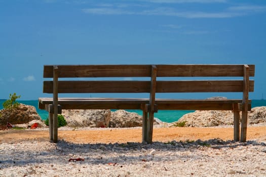 A bench overlooking the water of the Caribbean