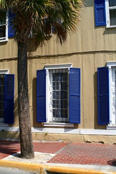 A home in Key West with blue shutters.