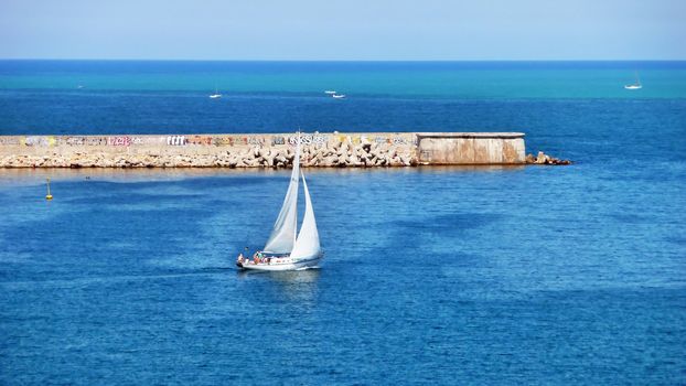 Walking yacht in the summer morning in a bay of Sevastopol