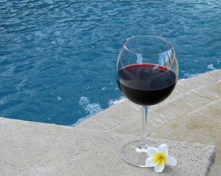 Set for a "staycation" with wine and plumeria petals in the backyard pool and suana.
