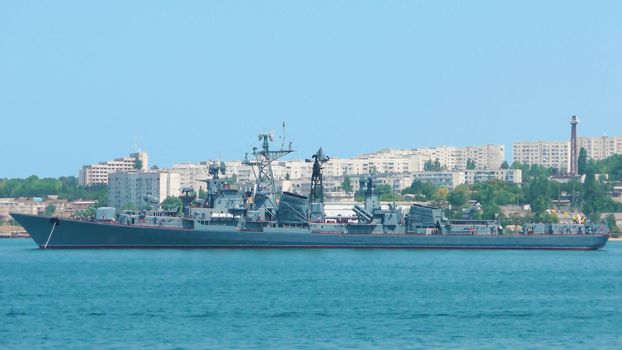 Military ship on anchorage in a bay