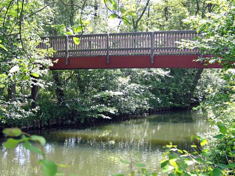 Beautiful small bridge over river Odense Denmark