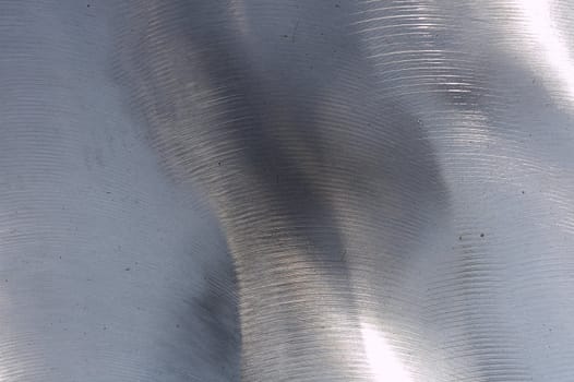 a close up picture of brushed metal surface