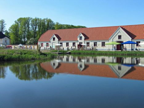 Castle buildings reflected in the water Valdemar Slot Denmark