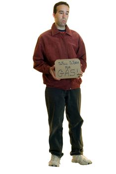 A young man holding a sign that says he will work for gas, isolated on a white background