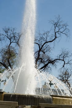 Close-up view of a large water fountain spraying water into the air