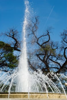 Close-up view of a large fountain spraying water into the air