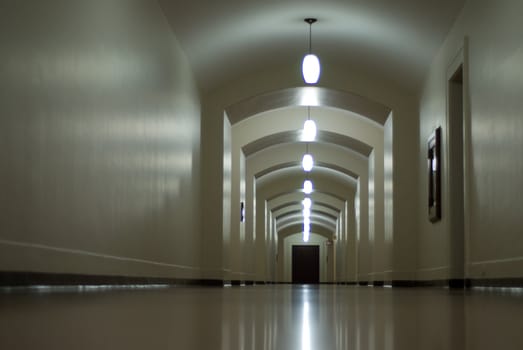 An empty hallway with a glossy floor