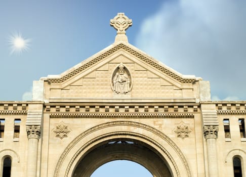 Exterior view of a stone monastery, shot against the sky