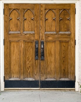 A set of large closed wooden doors