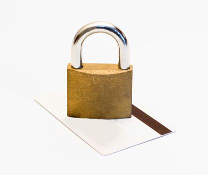 A locked padlock on a bank card, isolated on a white background