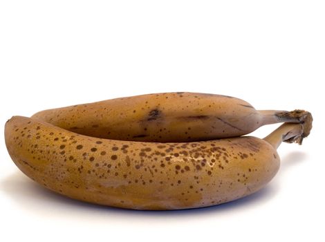 Two frozen bananas isolated on a white background