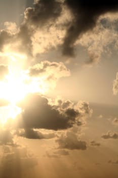 A dramatic sunset and the light and shadows from the clouds.