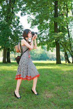 The girl photographes in park on rest