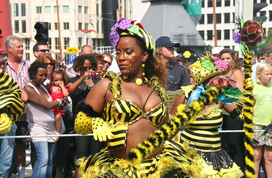 ROTTERDAM - SUMMER CARNIVAL, JULY 26, 2008. Carnival dancers with Bees theme at the Caribbean carnival parade in Rotterdam on July 26.