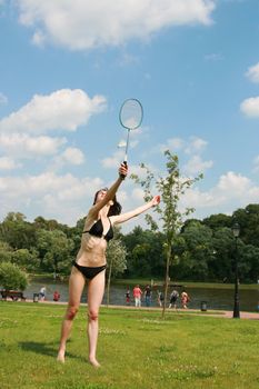 The girl goes in for sports a sunny day