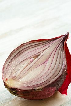 Detail of half of red onion on the table