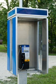 An open style telephone booth outside