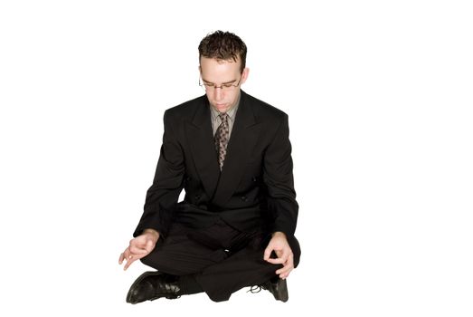 Businessman meditating and relaxing isolated against a white background