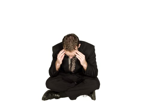 Businessman has a headache isolated against a white background