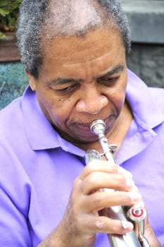 Jazz musician performing on his instrument.