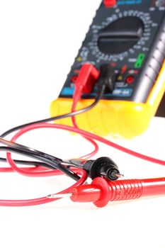 Wires connected to Digital multimeter for carrying out of measurements.